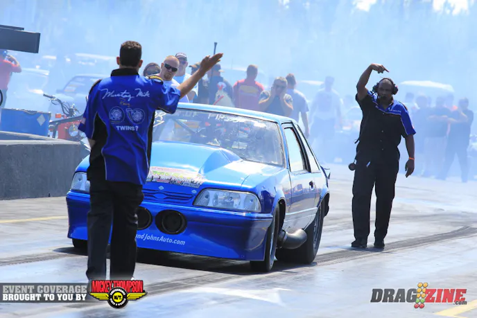 Mustang Mike leads Steve Schmidt Competition Engines/Monte Smith/Holley Outlaw Drag Radial with one round in the books with a 4.53 at 169 MPH. The team has struggled with the twin Procharger combo but things are starting to come together now.