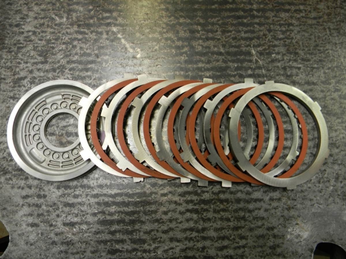 An exploded view of the reverse clutch pack, with six heavy duty frictions and standard non-coated steels.