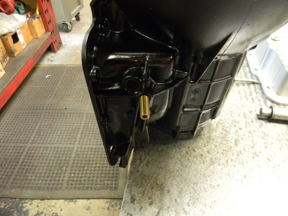 32) Band adjuster screw installed in trans case