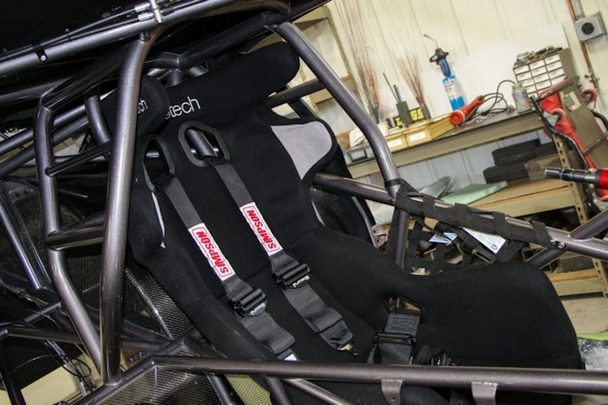 Here's the Racetech Carbon/Kevlar Seat along with custom Simpson light weight 7-point harness installed.