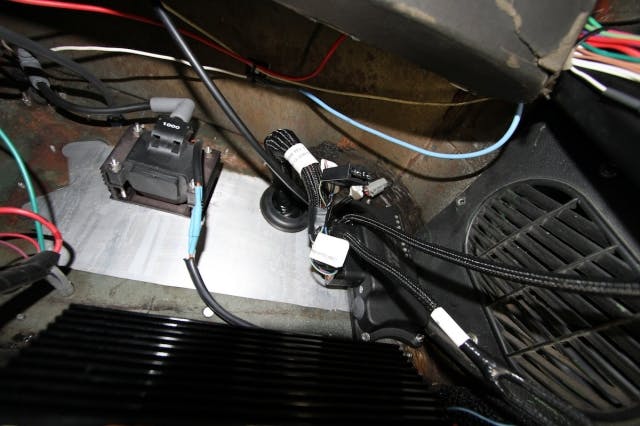 The system's ECU was mounted in the upper engine firewall in the passenger compartment where the heater/blower unit used to be. The ECU receives signals from the sensors and determines how long and when the injectors need to be open.