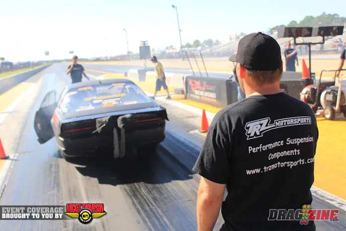 Frank Meshaw set high MPH running a 4.55 at 173.84 winning his match with Chris Tedeschi. here Kevin Smith (in front) and Eric Kenward get him backed up into the grove.