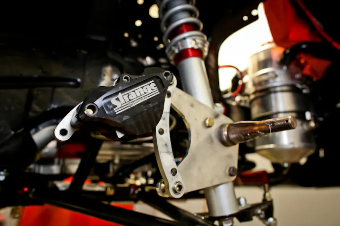 Carbon fiber brakes, originally developed for use in large aircraft, use carbon fiber brake rotors mated with carbon brake pads to create a stopping force with incredible heat management