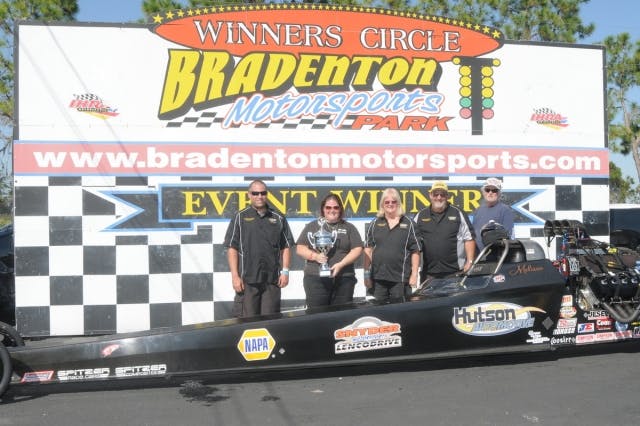 Melissa Hutson had luck go her way this weekend winding up in the winner circle after qualifying eighth. Severe tire shake in qualifying had the team making repairs the rest of the Saturday but she ran a 3.80 and a 3.81 to make it to the final with Matt Gilmore who could not make the call after breaking a pushrod taking out Bob Bridges with a 4.06 in the semis. She took the tree for the win and shut it down. Photo courtesy Bryan Epps.