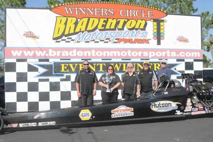 Melissa Hutson had luck go her way this weekend winding up in the winner circle after qualifying eighth. Severe tire shake in qualifying had the team making repairs the rest of the Saturday but she ran a 3.80 and a 3.81 to make it to the final with Matt Gilmore who could not make the call after breaking a pushrod taking out Bob Bridges with a 4.06 in the semis. She took the tree for the win and shut it down. Photo courtesy Bryan Epps.