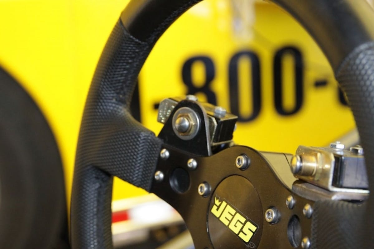 On the steering wheel of Troy Coughlin's JEG'S Corvette, you can see how he's arranged both the Bump Box and transbrake switches within close reach of this thumbs on the steering wheel.