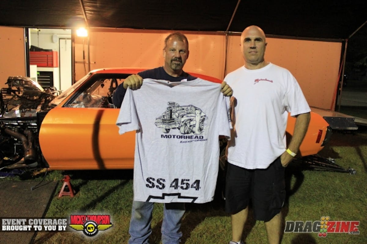 Gary Zueyus from Motorheadshirts.net stopped by Mike Murphy's pit with a gift of a T shirt. He does all his own art, including airbrush work and painting as well as design and vehicle wraps.