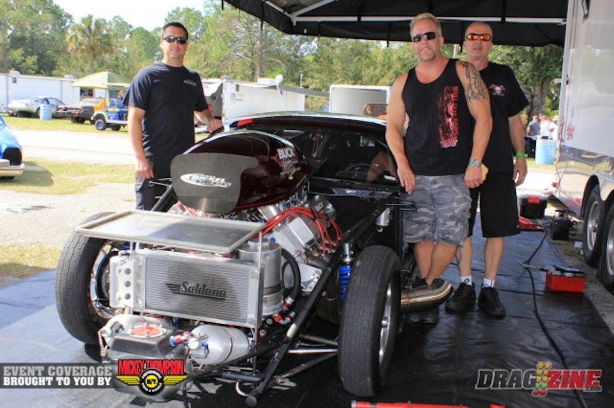 Chuck Mohn has his Jerry Bickel built ADRL Pro Nitrous Camaro here this weekend for some Pro Street action. The big block Chevy is maintained by Charlie Buck Race Engines and Chuck will be moving to a Sonny’s Racing 920 cubic inch mill for 2014. The ADRL is combining Pro Mod and Pro Nitrous for 2014 as many cars are running similar ET’s these days. Mohn has plans to run the full ADRL season and Extreme Outlaw Pro Modified for 2014. This weekend crew is Todd Fontana, Chuck Mohn and Billy Wallick from left to right.