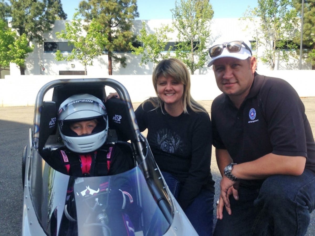 9-year old Autumn Hight (left) with mother Adria Hight (the eldest daughter of 16-time Funny Car champion John Force) and her father, 2009 Funny Car champion Robert Hight.