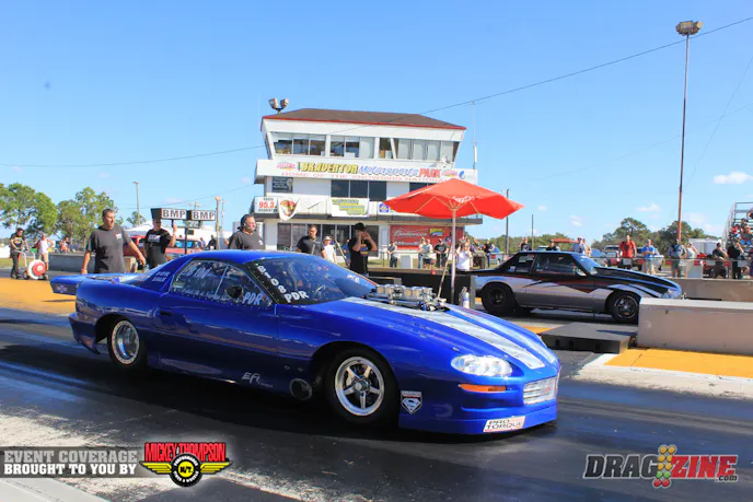 Scotty G. blew the hood scoop off last night after breaking two rocker arms in testing. He is fourth with a 4.80 at 153 after a soft launch. Scott Husted (far lane) had to shut off early and coasted to a 5.71 for sixth spot.