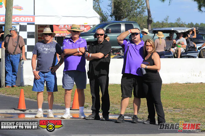 Mark McElwee sits second with a 3.784 at 196.76 MPH, good for high MPH so far today. Here the crew watches some of the other competitors in class.