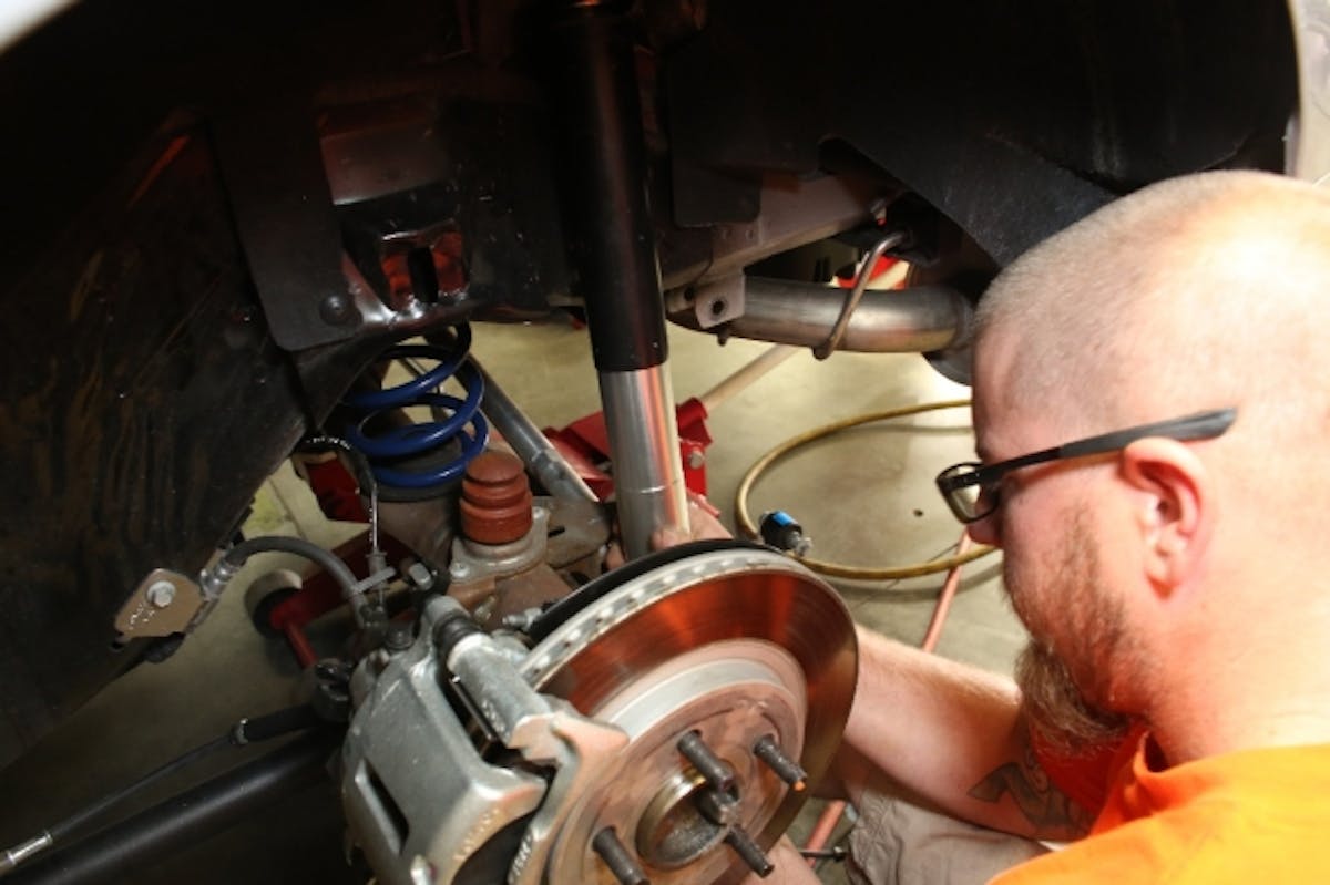 Swapping the rear springs and shocks can be done on the ground with a pair of jackstands and a jack - once the shocks are out of the way, simply pull the spring, swap the isolator to the new spring, and reinsert. Shocks are a bolt-in.