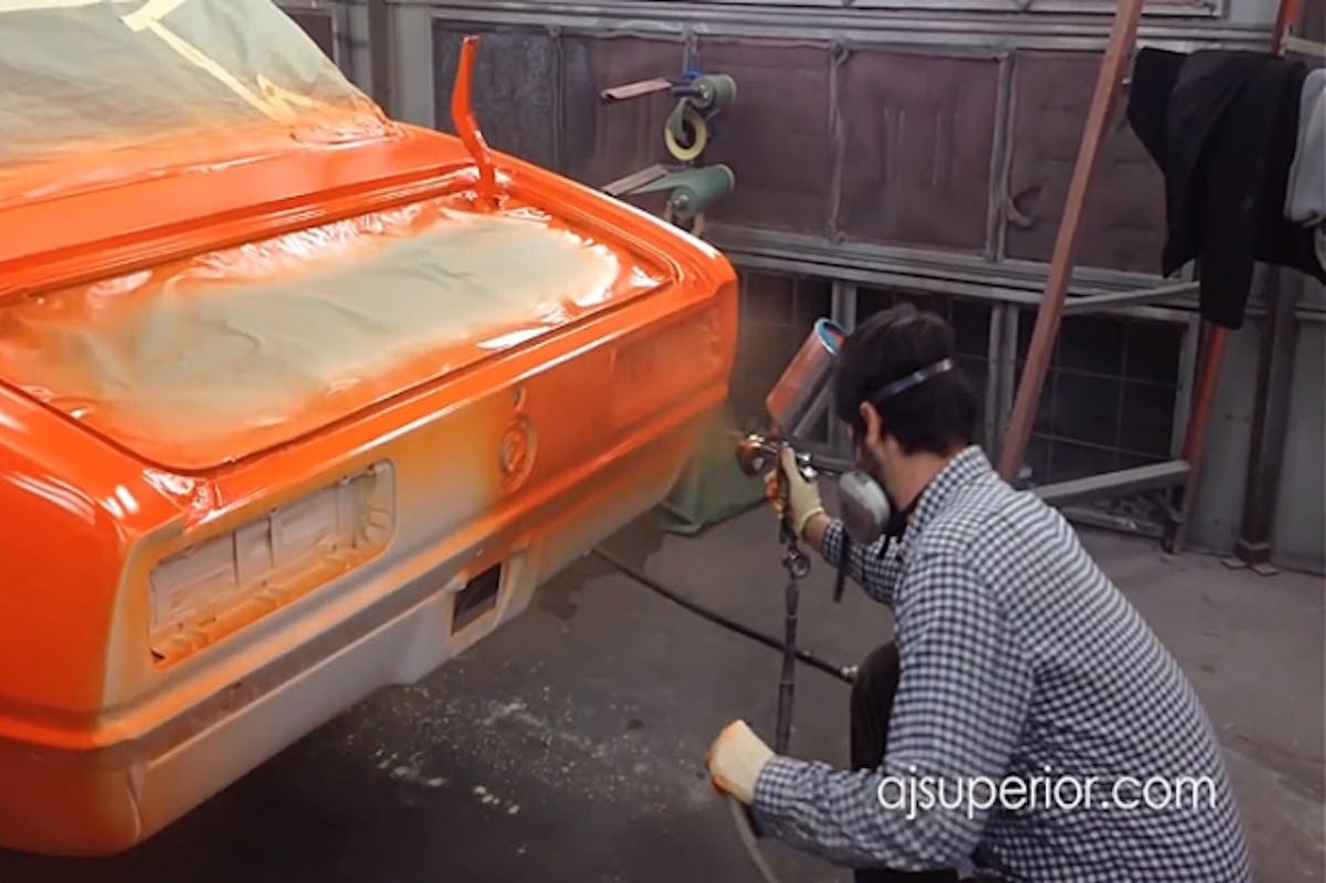 Hundreds of man hours into the project, Justin is busy painting the rear panels.