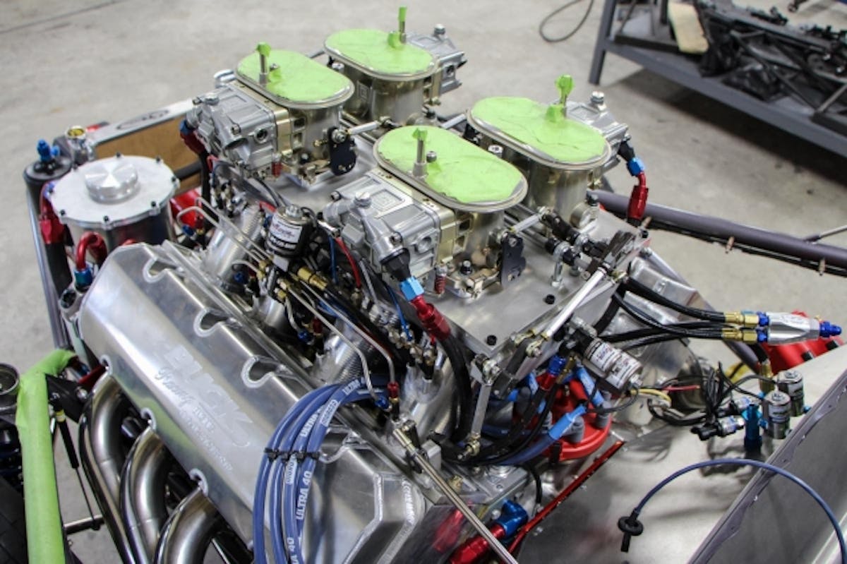 Now that's a powerplant! 864 cubic inches of Buck Racing Engines power topped with Braswell Split Dominators and lots of Switzer Dynamics nitrous solenoids.