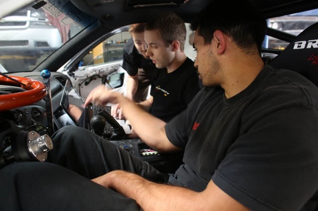 Jodran, Cunningham, and Brown collaborate on the tuning parameters for the car.