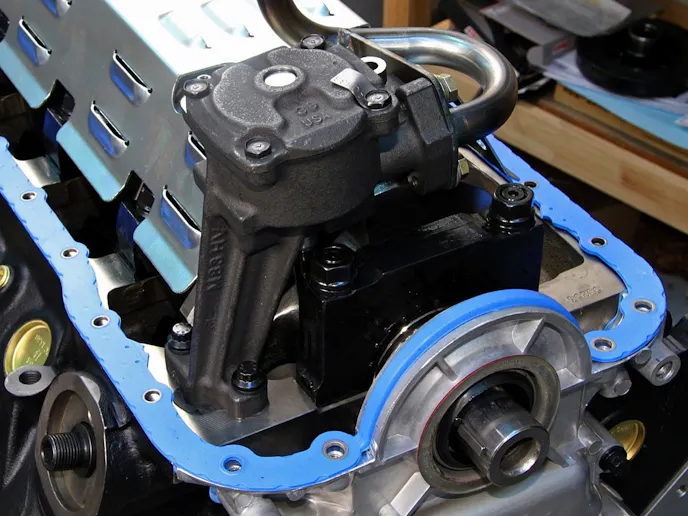 The one-piece oil pan gasket is designed to seal against leakage and provide proper clamping with the use of the built-in compression limiters.