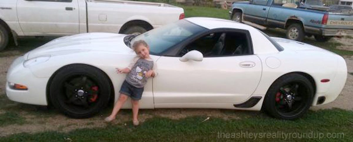 Lind's daughter Aubree with one of the two Corvettes - it's unclear if this is the car involved in the crash.