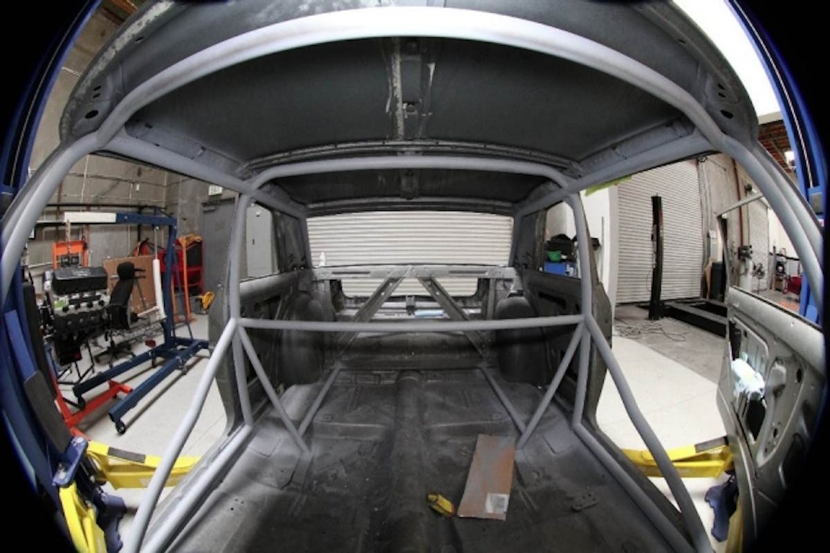 The completed 10-point roll cage in one of of our previous project vehicles, the MaxStreet '66 Chevy II.