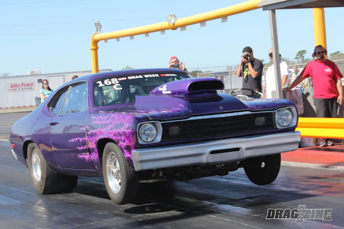 Eddie Miller made the tow up from Port St Lucie, Florida with his Drag Week winning Duster. He faced a late thrash session after tearing the engine down to replace the head gaskets a couple of weeks ago.  On day three of Drag Week Eddie lost a fuel pump causing a lean condition, burning several spark plugs and hurting a head gasket. Lucky for him it’s a naturally aspirated combo so there was no catastrophic damage as would be seen with nitrous or a boosted combo. Once into the engine he found a broken ring land and had to order some replacement pistons which came just in time for Eddie to get the engine back together Saturday morning. Eddie owns The Engine Works full service machine shop in Port St. Lucie. Sponsors include Pro Systems, Gear Vendors, JW Performance, CP Pistons, GRP and Jesel. He will be switching to EFI soon with help from Aeromotive and Holley Dominator EFI. Power comes from a big block Chrysler topped with canted valve heads from Indy Cylinder Head.