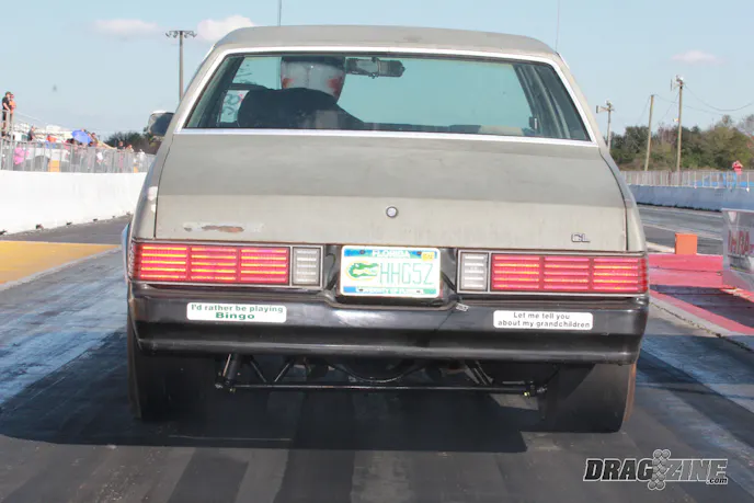If you have followed our outlaw racing coverage of the 2013 Orlando World Street Nationals you may recall the Zombie Wagon from the folks at Headhunter Racing. The crew threw this box Chevy together over a couple of weekends for this event, turning their parts car into a street brawler with parts they had laying around along with a rear housing and suspension from TRZ Motorsports. They blew the dust off a small block Chevy that was sitting in a corner of the shop, added a plate system, dropped it between the frame rails and came out to have some fun with Luther Hawkins tagged for driving duties. The Headhunter crew hails from Ocala, a community well known for it’s street scene back when. It’s fair to say anyone who was anyone coming up in the 80’s or early 90’s in the central Florida area street scene paid their dues at Moss Bluff.
