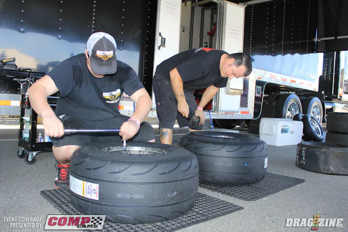 The Micky Thompson crew is already hard at work installing new tires for the racers. They will be working hard most of the weekend.