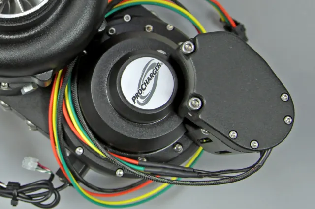 Contained within the bottom half of the supercharger assembly is the unique dry-hybrid belt drive that allows for programmable levles of boost.