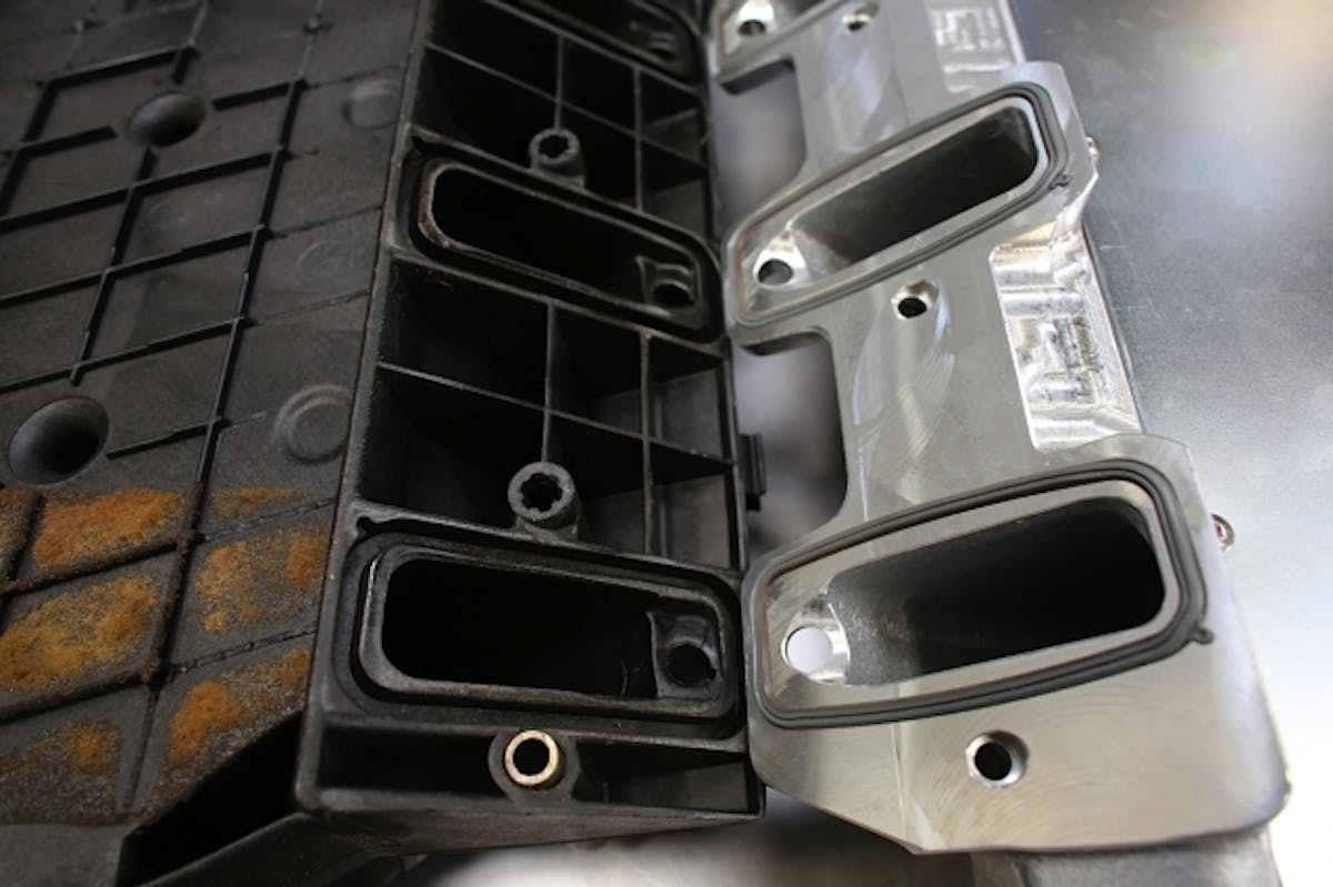 The SSI manifold uses factory-style O-ring seals. In this view, you can see how the aluminum construction offers an opportunity for porting that the thin-walled composite doesn't.