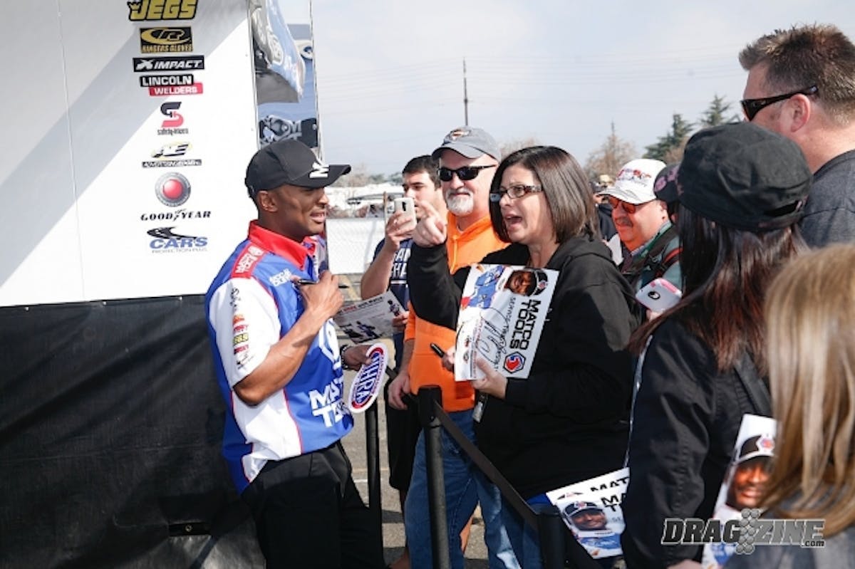 Antron Brown, running with the Don Schumacher team, won the Top Fuel championship in 2012 but came in runner-up to Shawn Langdon last year. He's on top of the qualifying sheet (a spot above Langdon) after Friday's rounds. Antron is always a crowd favorite, and was one of the first drivers we saw standing at the ropes signing autographs and taking photos with fans. 