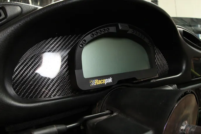 Racepak's IQ3 display dash offers built-in programmable shift lights and displays a wide variety of customizable information.