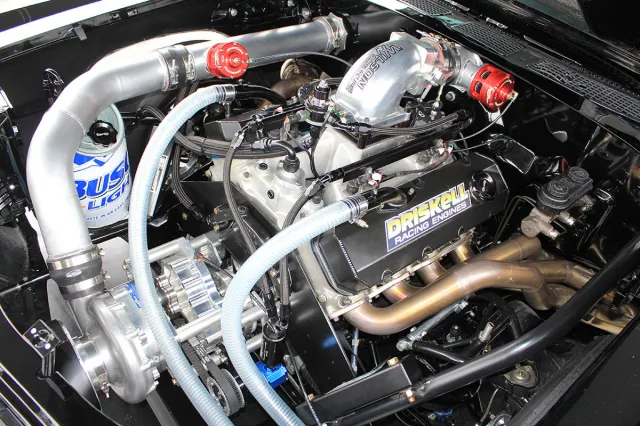 With a Procharged 540ci engine, this Outlaw 275 Radial Chevelle means serious business. Check out the custom vinyl wrapped fuel cell at the front of the engine.