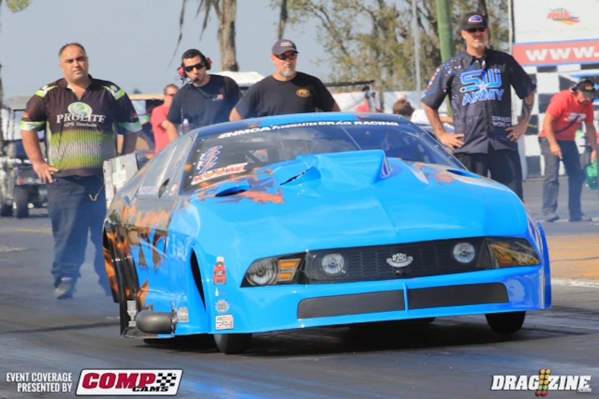 Kevin Fiscus lit up the boards to the tune of 5.89 at 248 to lead the Kooks Pro Mod field int he first session today. The Fiscus/Klugger Racing team is happy with that run as it did what it was supposed to do. If the conditions are favorable in the morning they will be looking for a 5.85 ish run for the 2014 Pro Mod record.