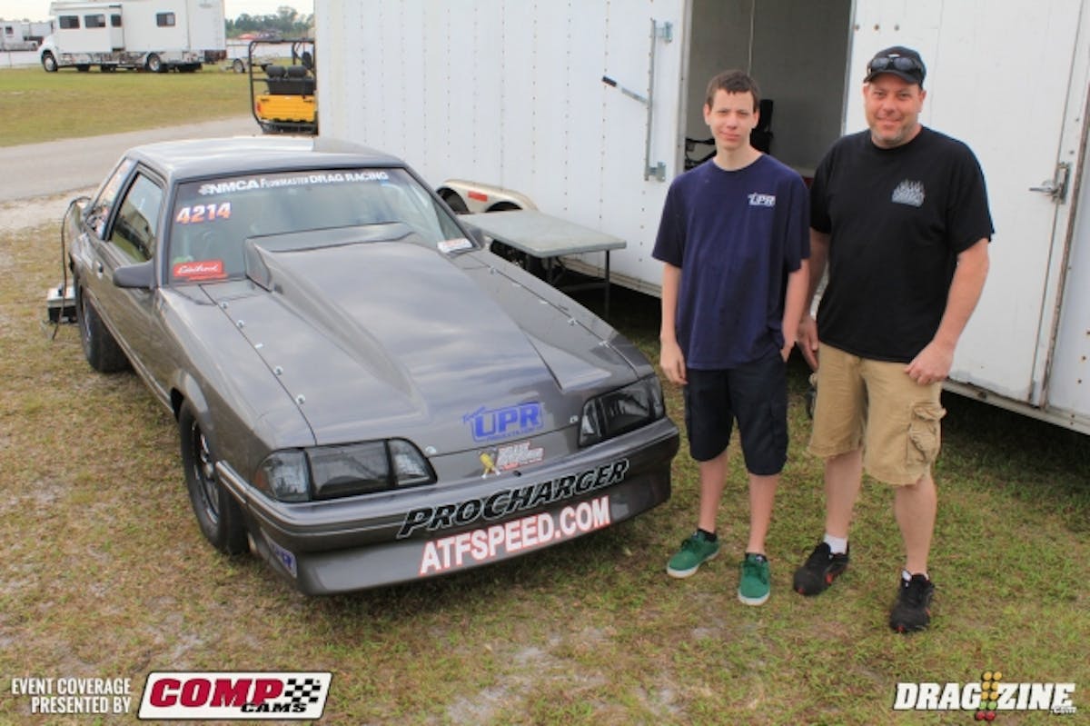 Bart Tobener is here running Edelbrock Xtreme Street this weekend with his Mustang crossing over from Renegade on the NMRA side. Changes for Xtreme Street include a lighter weight and larger throttle body. The rules for the class this year have been pulled back some to allow cars from Ultimate/Ultra Street to cross over into the NMCA with little to no changes to their combos. He landed second in the field with an 8.17 at 170 MPH. He enjoys running the NMCA Bradenton race bringing his sons to the race and dropping them off at home in South Florida after the race. Sponsors include Prestige Mustang, MV Performance and Diablosport. He runs a trans and converter from Automatic Transmission Factory behind the Procharged Mod motor. Bart (pictured lright) is shown here with his son William.
