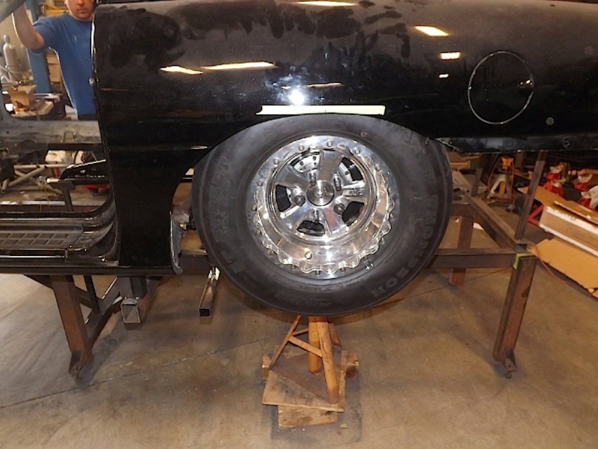 Mocking up the wheels and tires for fitment is critical at this stage. This photo shows actual ride height and placement of the tire in the wheel well. We'll be using Tim McAmis Race Car's 34-inch mini-tubs in this build, which are specifically designed for drag radials.