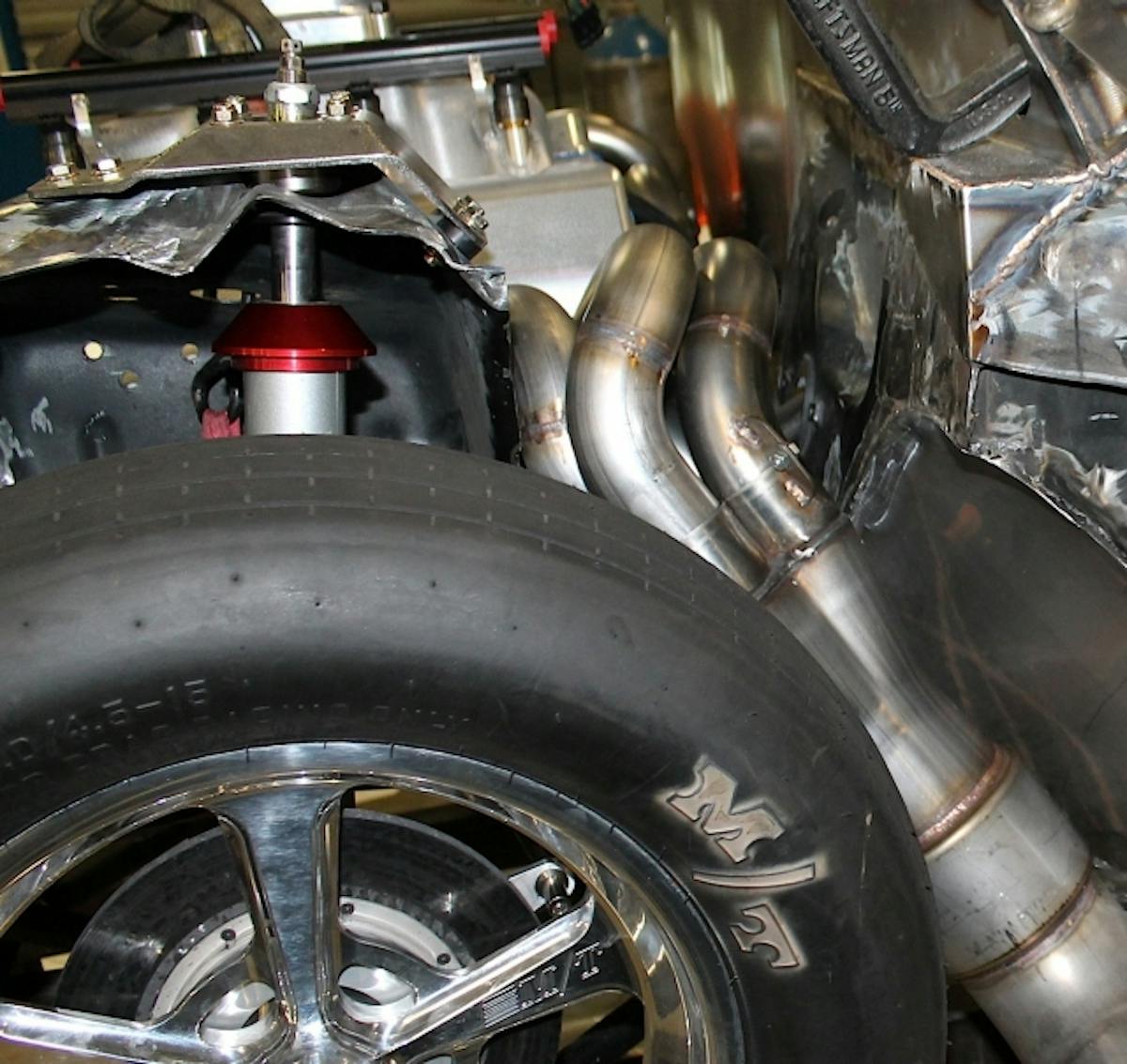 The boys at Kooks hooked us up with a complete Kooks Bullhorn Stainless header kit that Greg Holman at REF used to build our headers. The Kooks kit from Chris, Jr. and the race experts in NC comes with pretty much everything you need to build the system – from the collector to the 2-1/4 and 2-1/8 tubing and flanges. We will have a complete gallery and story on the header assembly but this is a cool shot of the final product (all except the bullhorn itself). The muffler and bullhorn is 4.5-inches.