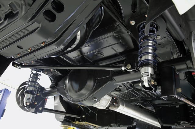 A final view of the completed Strange Engineering axle assembly, brakes, and COPO suspension parts mounted in the car. As Allen said during our conversation, if we didn't know any better, we'd think these were factory parts. Oh..wait..they are!