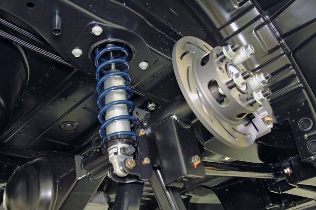 A closer look at the upper spring mount bolted into the chassis.