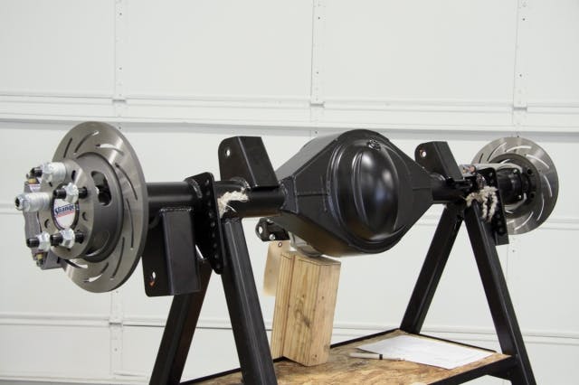 The Strange Engineering nine-inch Ford housing is packed full with a lightweight spool and 35-spline axles. Brackets to fit the Camaro body are installed at the Strange factory before powdercoating.