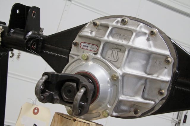 Heavy-duty parts are used throughout the construction of the rearend, including thick-wall three-inch tubes and Strange's aluminum Pro HD center section. A forged pinion support and 1350 yoke is installed on the front of the pinion.