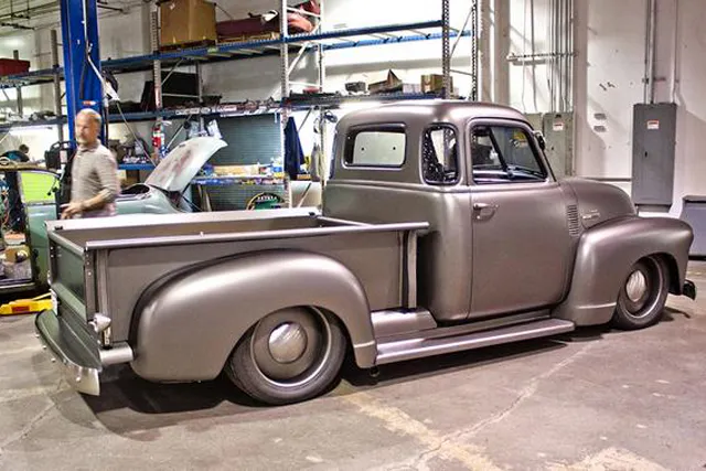 Ward walks around a signature ICON vehicle, the ICON TR (based on the Chevy 3100 Thriftmaster).