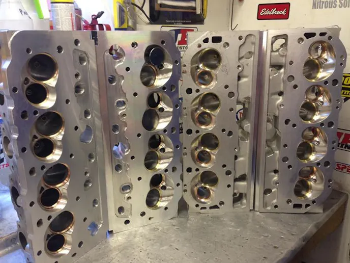 Last year the team used a set of experimental billet cylinder heads equipped with cooling passages (left), but this year they've switched to a cast set of heads with the same port and chamber profiles.