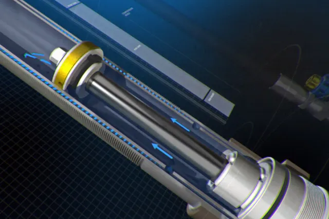 During compression, oil flows freely through ports that lead to refill holes on the bottom.