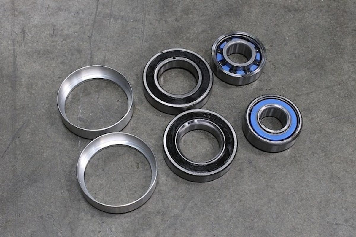 Here's the ceramic bearings from Performance Bearing that we'll be replacing the roller-style bearings with in the front wheels. As you can see, these aren't angular, but are your more common ball bearing with an inner and outer race, and use a steel "cup" that hold them in place in the wheel.