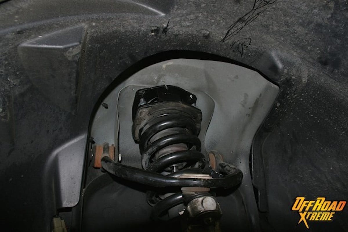 The spacer-equipped strut is now reinstalled in place.