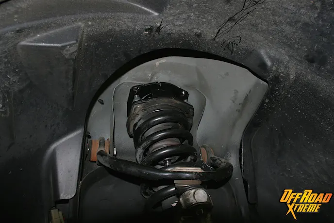 The spacer-equipped strut is now reinstalled in place.