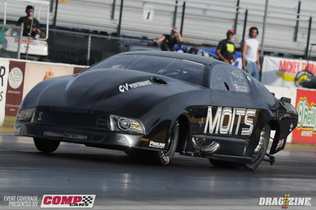 Less than a week ago, Australian star Paul Mouhayet's trip to the United States was in jeopardy after a high-speed crash off the end of the Sydney Dragway in his Outlaw 10.5 Mustang that cause injuries to his ankle. But not one to let a little accident deter him, Mouhayet and company hopped on a bird destined for Missouri to give their brand new Tim Mcamis-built Pro Modified machine a thorough flogging. And that they did; after a shutoff run in th 5.80's last night, Mouhayet cooked the already red-hot Gateway quarter-mile to the tune of a 5.75 at 260 MPH and change in testing this afternoon, setting the bar really high for the rest of the Outlaw Pro Mod class.