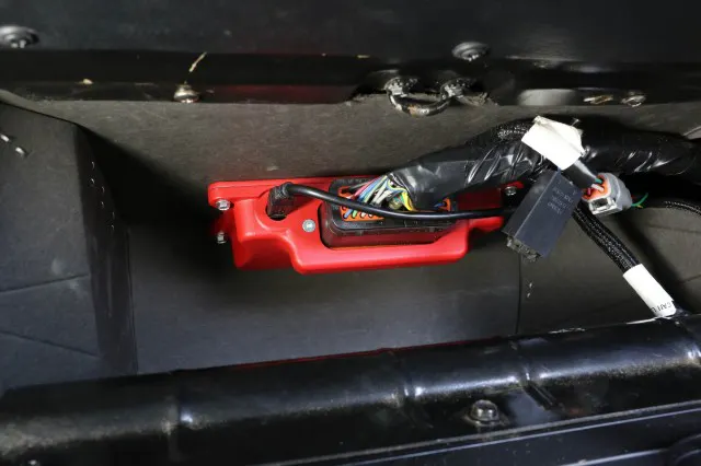The XFI Sportsman ECU is small enough to tuck out of the way in our glovebox for easy access.
