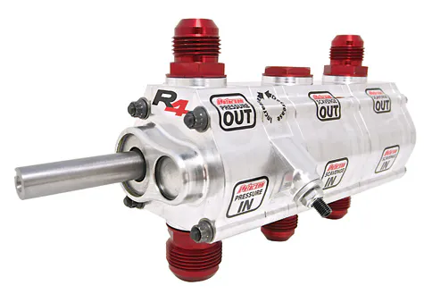 Peterson Fluid Systems wanted to make packaging a vacuum pump into an external wet sump oiling system easier. Enter the Wide-VAC. The Wide-VAC is a 3-stage lobe rotor pump with a dual purpose. A single 1.4” front stage pumps oil from the pan to the engine for lubrication. Dual 2.4” rear stages pull air out of the engine to create a vacuum on the crankcase.