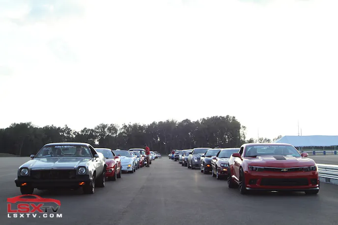 Cruise participants line up on the NCM Motorsports Park's 'black lake' before taking their parade lap.