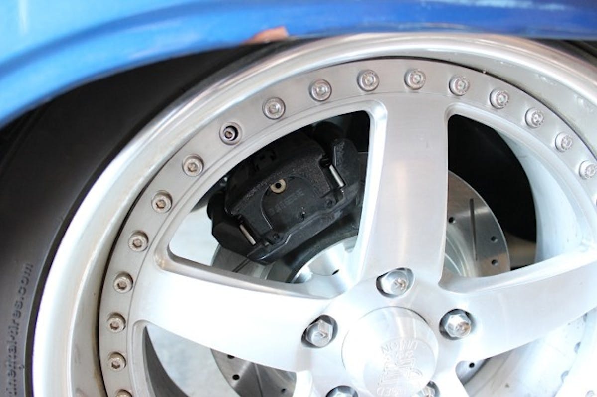The rear caliper which also acts as the parking brake.