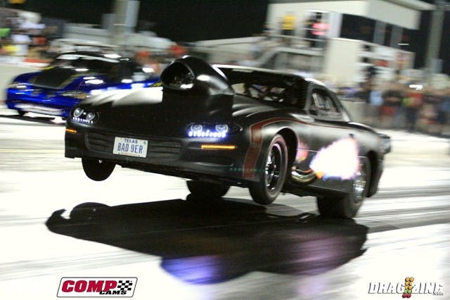 Once into the semi finals of PTC Radial vs the World it was Kyle Hutell and Brad Edwards wit the other pair being Jamie Hancock and Dewayne Mills. Word was Mills was hurt and he certainly was blowing smoke on his round 3 win over Jeff Cooner with a 4.13 at just 187 MPH. Edwards and Hutell were the first pair up and Texan Hutell cut the tree down with a .013 reaction to Edwards .041 giving the nitrous huffing Camaro a big lead. Edwards faltered at the start while Hutell started pulling the front end up and drifting right. He stayed in it as long as he could but crossed the center taking out the cones at the stripe recording a 4.30 at 154 to Edwards default win 4.33 at 154.